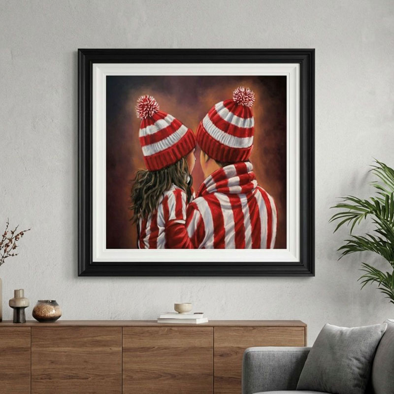 A framed example of one of the Emotions of Football paintings