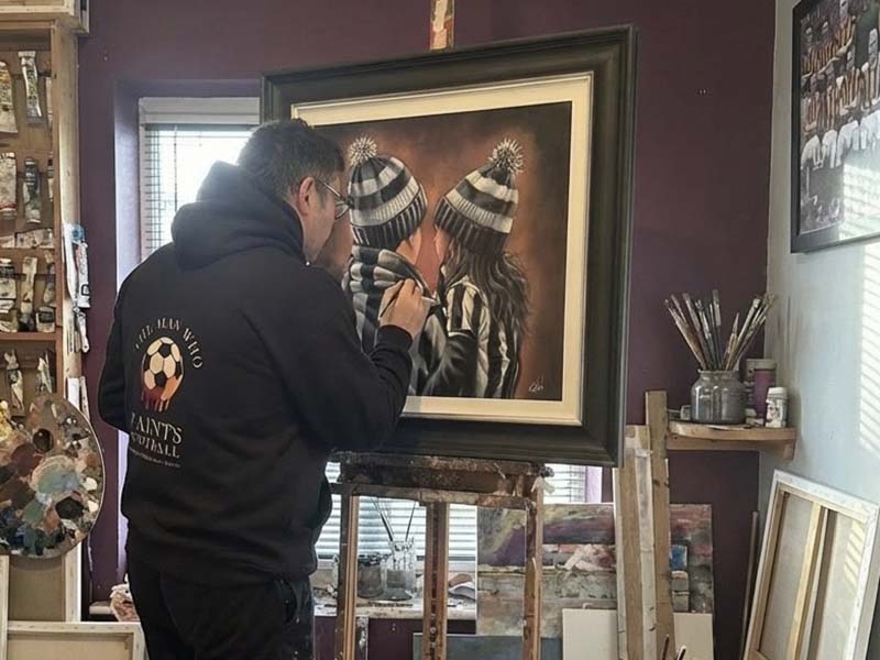 Paul painting in his studio